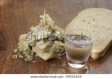 Vodka shot, herring bite and slice of bread - traditional way of vodka consumption in Eastern Europe.