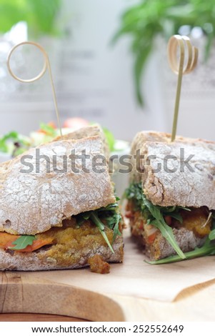 Bombay masala sandwich with chicken, rocket and green salad.