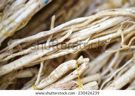 Dried milk vetch root close-up, various medicinal herbs of traditional oriental medicine