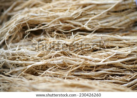 Dried milk vetch root close-up, various medicinal herbs of traditional oriental medicine