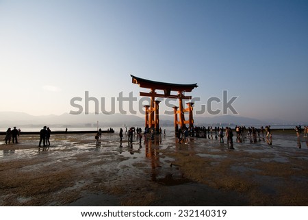 MIYAJIMA, JAPAN - MARCH 23: Tourists visit Miyajima Itsukushima Torii Gate on March 23, 2014. One of the top three \'must visit\' scenics in Japan, Itsukushima is flooded with tourists every summer.