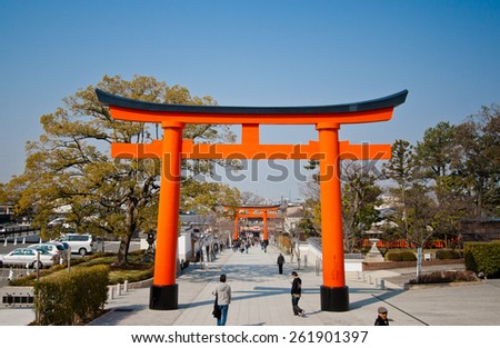 KYOTO, JAPAN - MARCH 24 : Many people walk pass the Gate of Fushimi Inari Taisha, in Kyoto Japan on March 24, 2014.