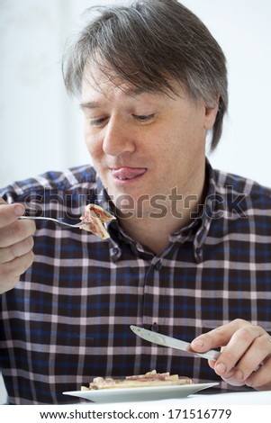 Man Eating Pork Meat