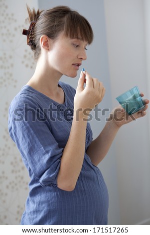 Pregnant Woman Taking Medication