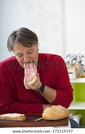 Man Eating Pork Meat