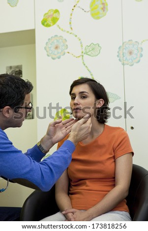 Woman Palpating Lymph Node