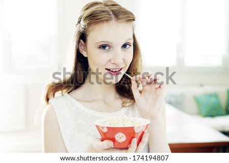 Woman Eating Raw Vegetables