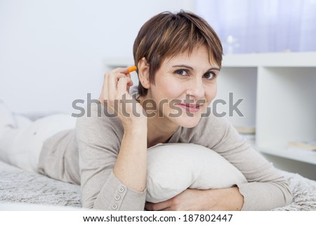 Noise control plug for middle aged woman in bed