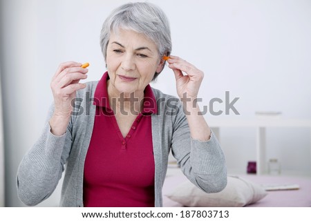 Elderly woman using Noise Control