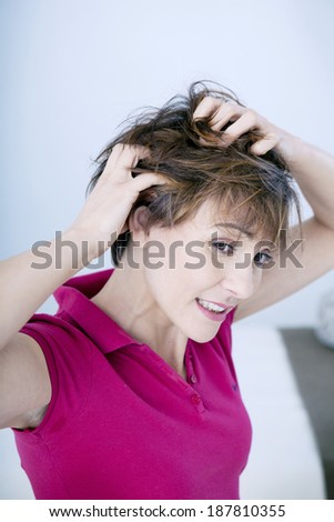 Woman itching her hair