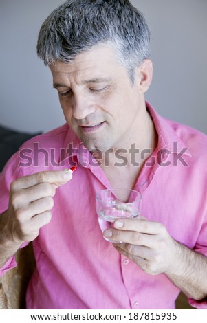 Man Taking Medication