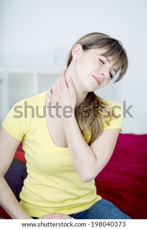 Woman suffering from cervical pain.