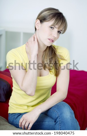 Woman suffering from cervical pain.