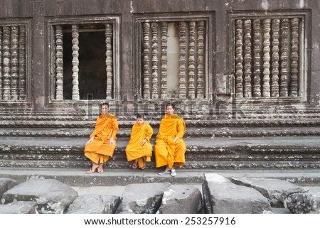 SIEM REAP, CAMBODIA -JAN 31 : Angkor Wat young buddhist monk. Famous landmark, place of worship and popular tourist travel destination in Asia. On January 1, 2015 in Siem Reap,Cambodia.
