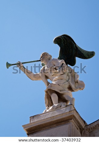 A sculpture atop a church in venice... near st.mark\'s square