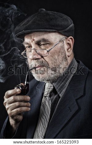Senior man with smoking pipe
