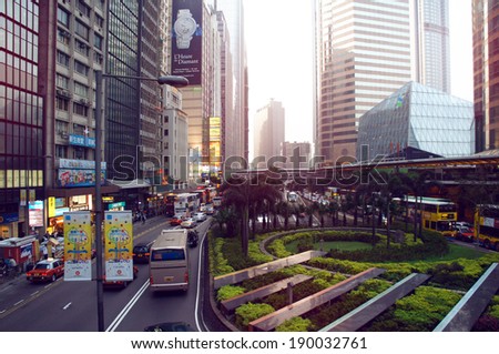Connaught Road Central Of Hong Kong at sundown/HONG KONG  - MARCH 19: People, cars and urban transport move alongside of the Connaught Road in the Central district on March 19, 2014 in Hong Kong.