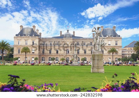 PARIS - SEPTEMBER 30: People walk at the Luxembourg Garden near Luxembourg palace in autumn sunny day on September 30, 2014 in Paris.