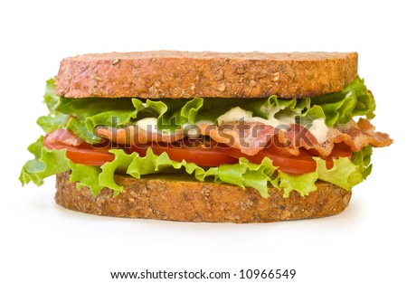 BLT Sandwich. Whole wheat toasted BLT (Bacon, Lettuce, Tomato) sandwich with mayonnaise isolated on white background