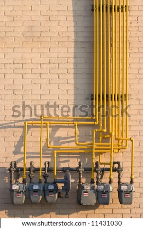 Maze of pipes and natural gas meters. Concept for raising energy or utility costs, environmental concerns or advantages of alternative heating methods.