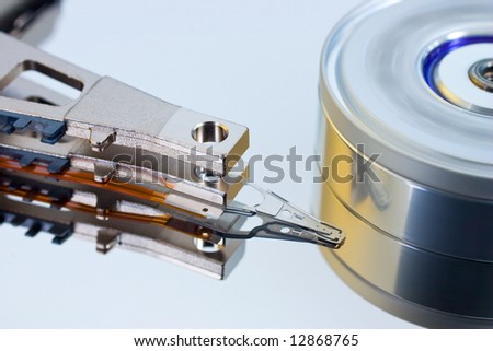 Detail of computer hard disk head and spinning platters