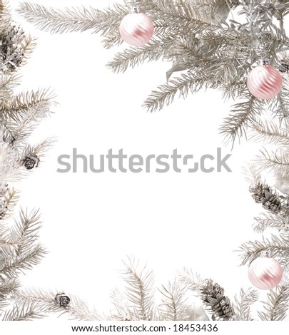 Silver tree branches arranged with glass baubles framing the picture