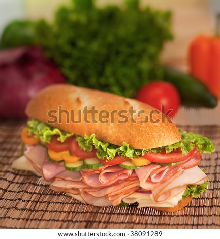 Loaded submarine sandwich with turkey, ham, cheese and fresh veggies