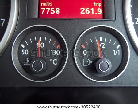temperature and fuel gauge from a car dashboard