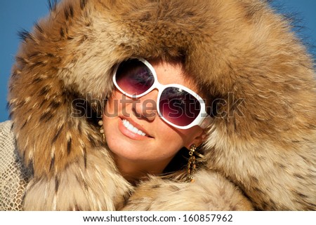 Winter Woman Portrait. Beauty Model Girl. Fur Fashion. Beautiful Girl in fox fur
