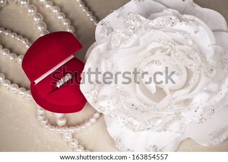Diamond ring in heart shaped, red jewel box.