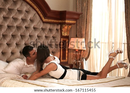 Sexy Young Couple Kissing In A Hotel Room