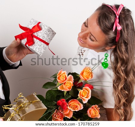Valentine\'s Day - Young Woman with Bouquet of Flowers and presents