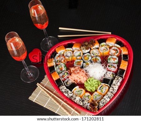 Traditional Japanese food Sushi. Closeup japanese sushi on a bamboo napkin. Sushi collection in valentines day.