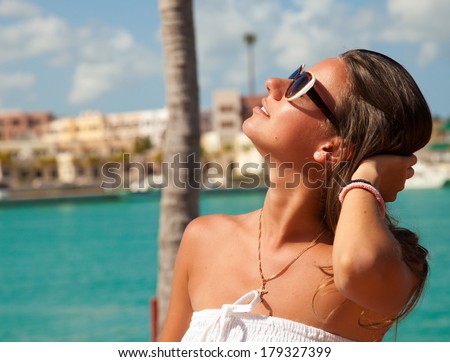 Portrait of the Glamorous lady at luxury vacation. Woman relaxing, dreaming and thinking looking happy up smiling cheerful.