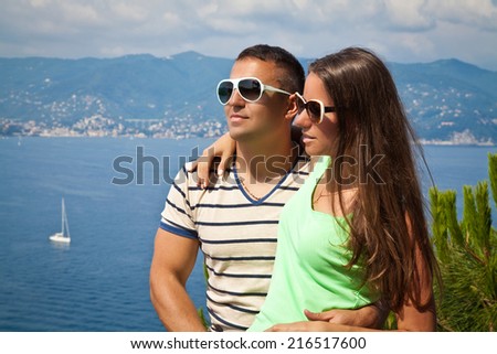 Tourists - happy couple in Italy, Portofino luxury landmark aerial panoramic view.