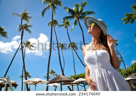 Beautiful young woman relaxing in luxury hotel. Feeling relaxed and naturally gorgeous in summer vacation, Hawaii