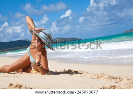 Laughing beach woman in bikini enjoying the perfect summer day on Waimanalo, Oahu, Hawaii, USA. Sexy girl on travel vacation holidays in laughter on Hawaiian Waimanalo beach.