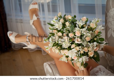 Perfect female legs wearing high heels. Sexy woman legs with white shoes. Holidays and celebrations concept.