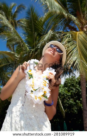 Happy people. Woman with welcoming Lei cheerful, happiness during summer vacation holidays on Hawaii. Hawaiian travel vacations in Waikiki, Honolulu city, Oahu, Hawaii, USA.