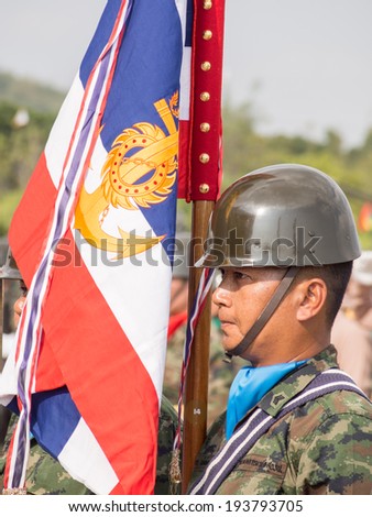 CHONBURI, THAILAND - JAN 18, 2014 : Unidentified marine with naval flag performing Military Parade of Royal Thai Navy on January 18, 2014 at Sattahip Naval Base, Chonburi, Thailand