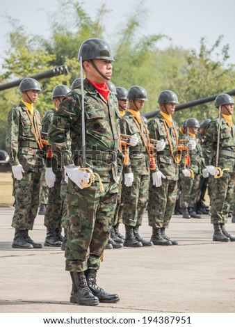 CHONBURI, THAILAND - JAN 18, 2014 : Group of marines with naval sword performing Military Parade of Royal Thai Navy on January 18, 2014 at Sattahip Naval Base, Chonburi, Thailand