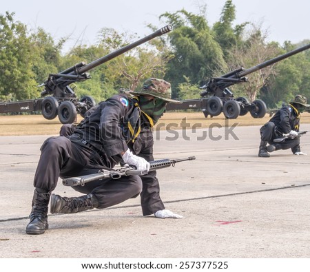 CHONBURI, THAILAND - JAN 18, 2015 : Unidentified Navy SEAL
performing combat training in Military Parade of Royal Thai Navy on
January 18, 2015 at Sattahip Naval Base, Chonburi, Thailand