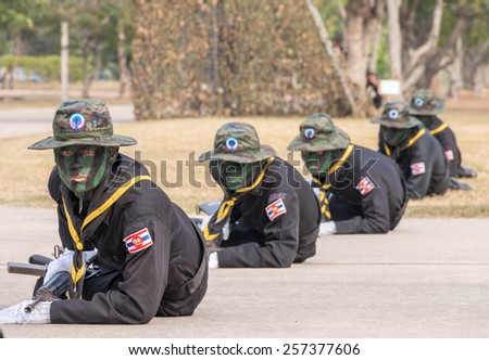 CHONBURI, THAILAND - JAN 18, 2015 : Unidentified Navy SEAL\
performing combat training in Military Parade of Royal Thai Navy on\
January 18, 2015 at Sattahip Naval Base, Chonburi, Thailand