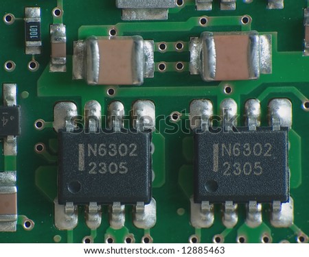 Close up electronics parts on green board