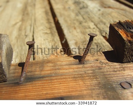 Rusty nails in wood
