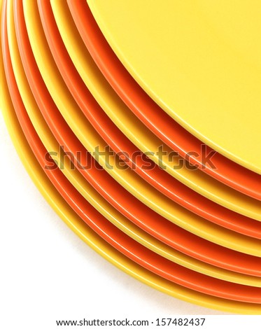 A stack of kitchen dishes on white background./Dishes.
