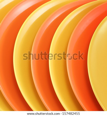 A stack of kitchen dishes on white background./Dishes.