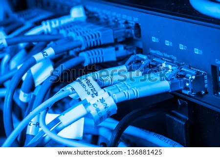 server with fiber optic  cables in data center