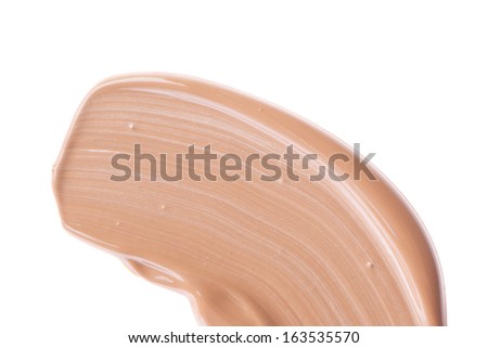 smudged liquid foundation isolated on white