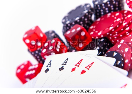 four aces with poker chips and two dice on white background